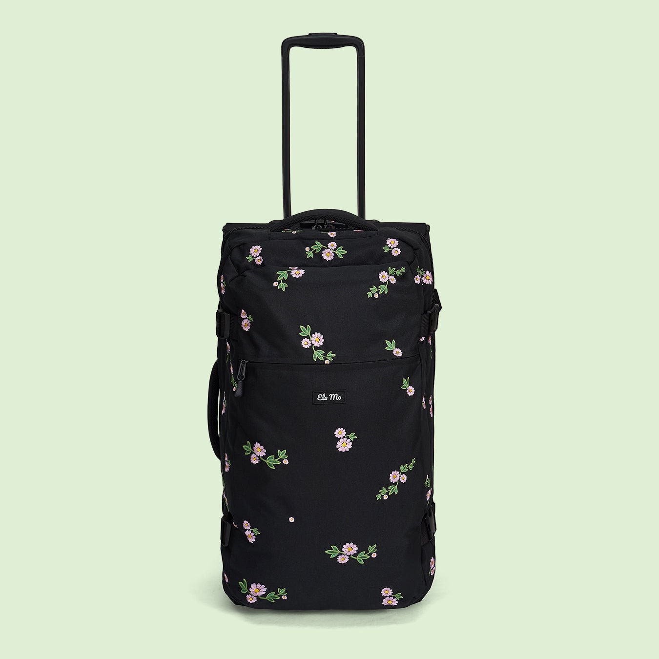 Ela Mo™ Reisetasche mit Rollen 78 Liter | Embroidery Edition Upsy Daisy. Schwarze, geblümte Tasche mit hochgezogenem Griff.