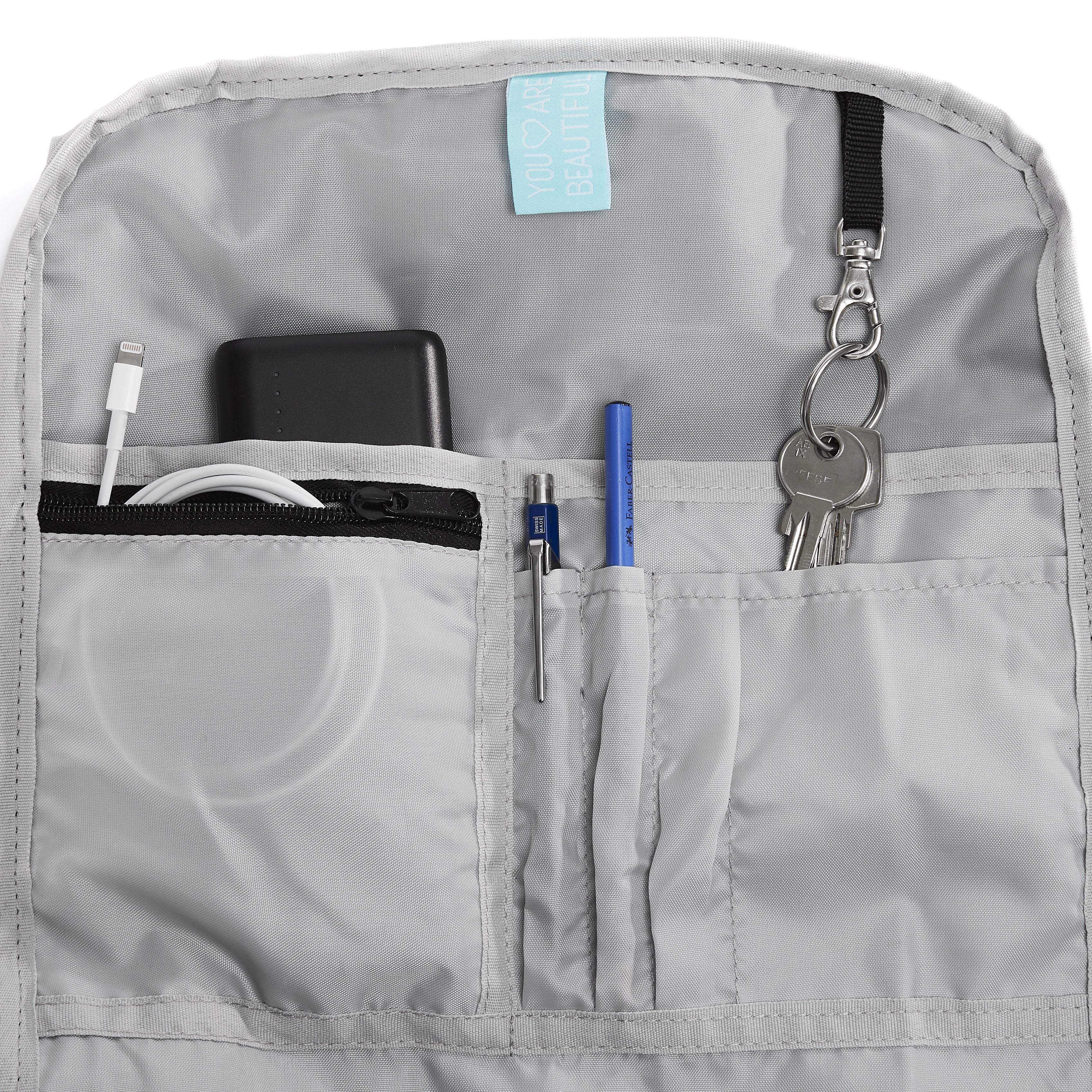 Ela Mo™ Rolltop Rucksack | Pink & Blue. Innenbereich des Rucksacks mit kleinen Fächern und Schlüsselanhänger.