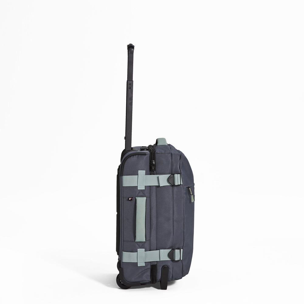 Ela Mo™ Reisetasche mit Rollen 42 Liter | Darkgrey Mint. Reisetasche mit Klickverschluss von der rechten Seite.