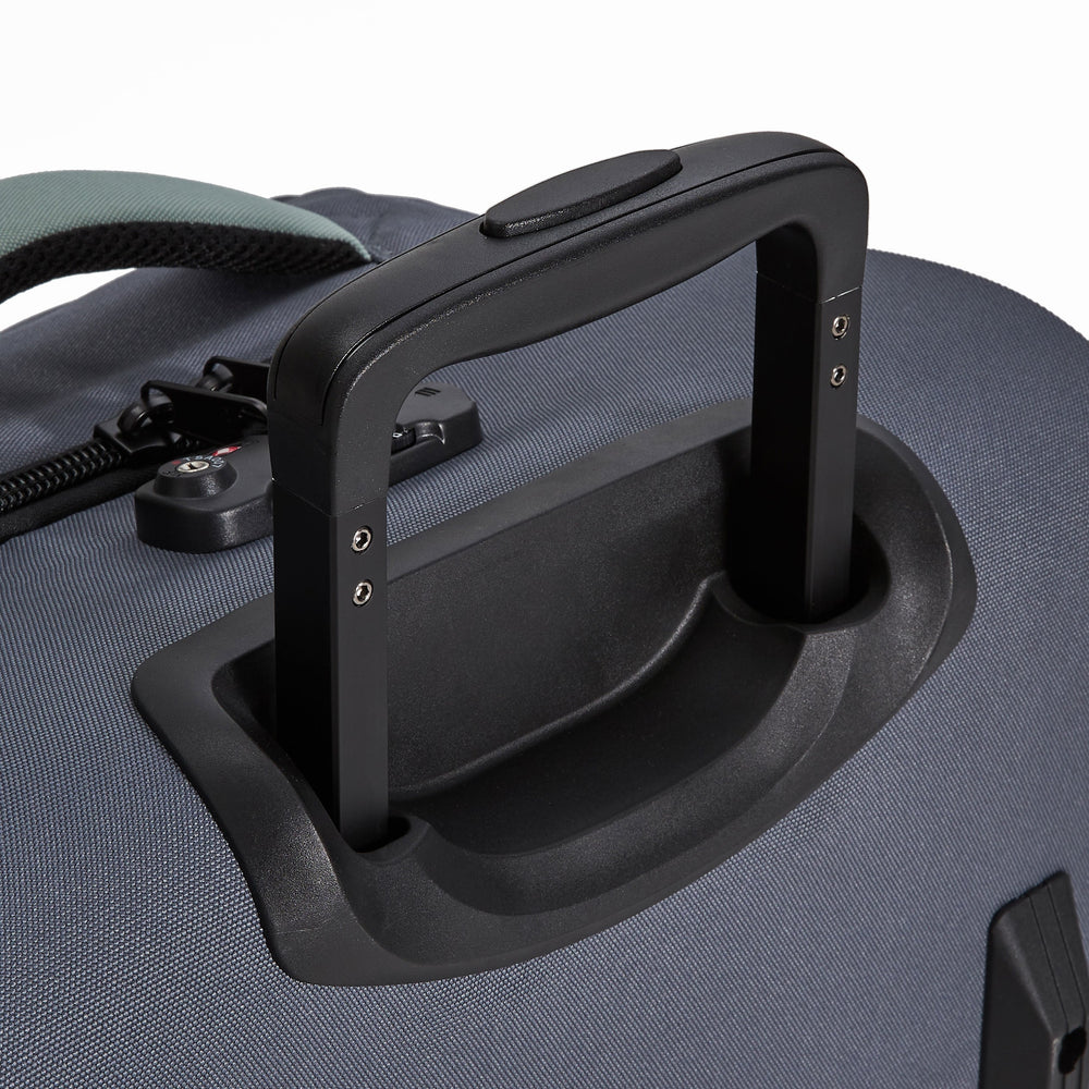 Ela Mo™ Reisetasche mit Rollen 42 Liter | Darkgrey Mint. Zwei Tragegriffe und TSA-Schloss an der Reisetasche.